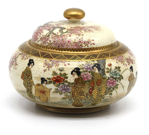 A Japanese Satsuma earthenware circular box and cover