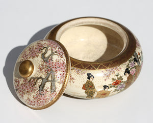 A Japanese Satsuma earthenware circular box and cover