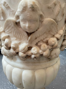 Large 19th Century White Marble Oval Urn with Cherub Motif
