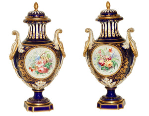 A Fine Pair of Sevres Style "Jeweled" Blue-Ground Vases and Covers