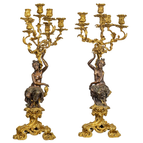 A large and fine pair of Louis XVI patinated and gilt-bronze figural six-light candelabra