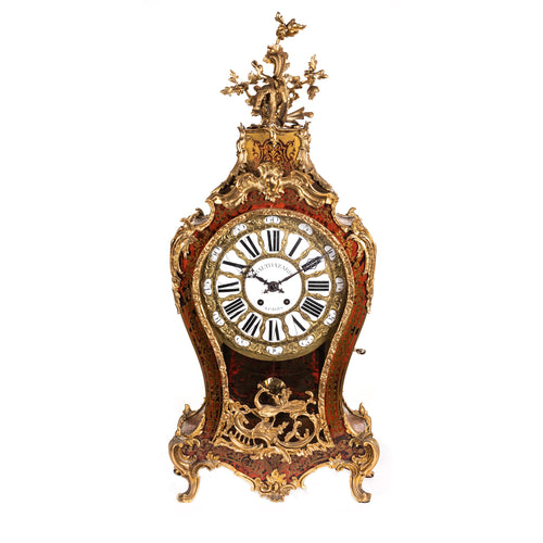 A brass inlaid tortoise shell, boulle marquetry veneered mantel clock