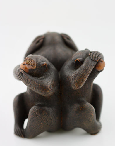 A Japanese wood okimono of three monkeys Meiji period