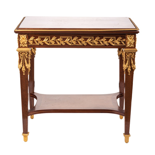 A Louis XVI style table in solid amaranth with gilt bronze mounts