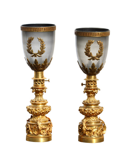 A pair of gilt-bronze lamps in the French Restauration style